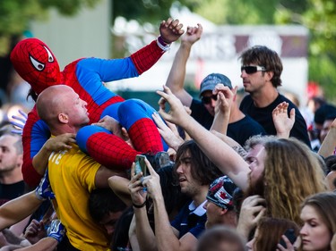 A music fan wearing a Spiderman costume body surfs during the performance by French band Gojira on day two of the Heavy Montreal music festival at Jean-Drapeau park in Montreal on Saturday, August 8, 2015.