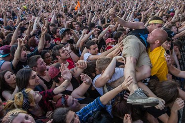 Music fans enjoy the performance by Canadian band Billy Talent on day two of the Heavy Montreal music festival at Jean-Drapeau park in Montreal on Saturday, August 8, 2015.
