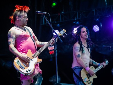 Mike Burkett, left, and Eric Melvin, right, of the American band NOFX perform on day two of the Heavy Montreal music festival at Jean-Drapeau park in Montreal on Saturday, August 8, 2015.
