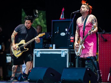 Aaron Abeyta, left, and Mike Burkett, right, of the American band NOFX performs on day two of the Heavy Montreal music festival at Jean-Drapeau park in Montreal on Saturday, August 8, 2015.