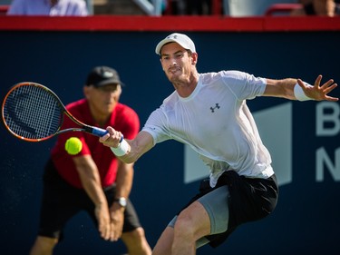 Andy Murray of Great Britain hits a return against Novak Djokovic of Serbia during the men's final for the Rogers Cup Tennis Tournament at Uniprix Stadium in Montreal on Sunday, August 16, 2015.