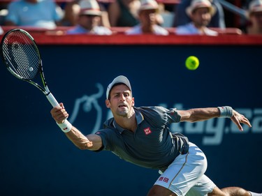 Novak Djokovic of Serbia hits a return against Andy Murray of Great Britain during the men's final for the Rogers Cup Tennis Tournament at Uniprix Stadium in Montreal on Sunday, August 16, 2015.