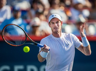 Andy Murray of Great Britain hits a return against Novak Djokovic of Serbia during the men's final for the Rogers Cup Tennis Tournament at Uniprix Stadium in Montreal on Sunday, August 16, 2015.