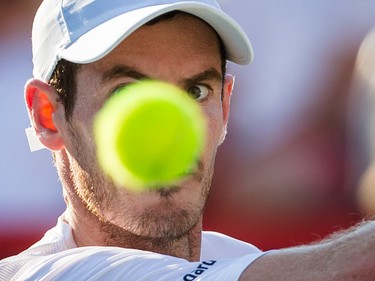 Andy Murray of Great Britain keeps his eyes on the ball as he hits a return against Novak Djokovic of Serbia during the men's final for the Rogers Cup Tennis Tournament at Uniprix Stadium in Montreal on Sunday, August 16, 2015.
