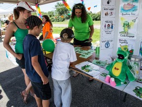 DOLLARD-DES-ORMEAUX, QC.: AUGUST 23, 2015 -- Candice Figueira (right) and Bessy Pilarinos (left) both part of the Snap's team, play a game with two kids at the DDO Civic Centre, on Sunday August 23, 2015, in Dollard-des-Ormeaux, Quebec. (Giovanni Capriotti / MONTREAL GAZETTE)