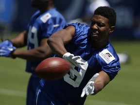 Indianapolis Colts wide-receiver Duron Carter catches during the NFL team's football training camp in Anderson, Ind. At training camp, Carter routinely wowed coaches, teammates and fans with long catches. But in the first two preseason games, Carter has only one catch for 16 yards.