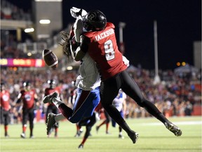 Ottawa Redblacks' Ernest Jackson (9) is blocked from receiving the ball by Montreal Alouettes' Dominique Ellis (38) during the second half of a CFL game in Ottawa on Friday, Aug. 7, 2015. The play was called as a pass interference in favour of the Redblacks. The Redbacks won 26-23.