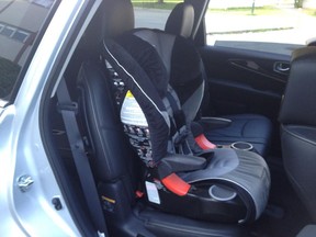 Even with a child seat in the second row, you can still access the third row seats in the 2013 Infiniti JX without having to remove the child seat. (Photo by Alexandra Straub, to illustrate her test-drive piece in the Luxury Cars section)