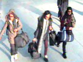 In this still taken from CCTV issued by the Metropolitan Police in London on Feb. 23, 2015, 15-year-old Amira Abase, left, Kadiza Sultana,16, centre, and Shamima Begum, 15, walk through Gatwick airport, south of London, before catching their flight to Turkey on Tuesday Feb 17, 2015. The three teenage girls left the country in a suspected bid to travel to Syria to join the Islamic State extremist group.
