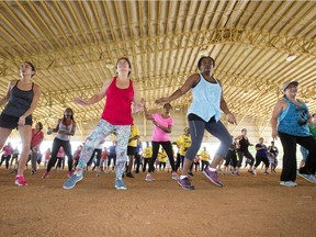 Workouts that include aerobic and upper and lower body muscular conditioning along with exercises that challenge balance will help delay the physical effects of aging. Above: women do dance exercises during a Fitness Dance Party  July 25 at Tropical Park in Miami.