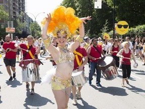 A dancer entertains the crowd during the annual Pride Parade in Montreal on Sunday, Aug. 16, 2015.