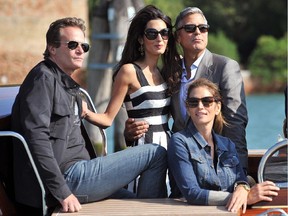 Cindy Crawford, seated, right, and her husband, Rande Gerber, left, with their pals George Clooney and Amal Alamuddin in Venice in 2014.