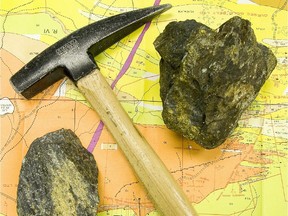 The gold mining region of Val D'Or is experiencing a bit of a boom due to the quantities of gold and other precious minerals as well as diamonds found in the Northern Quebec ground. Iconic image of survey map, geologist's hammer, loupe or hand glass and rock containing real and fool's gold.  Gazette Photo Dave Sidaway   For use in mining supplement