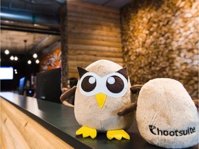 HootSuite's owl mascots are shown in the company's cabin-themed office in Vancouver. In Canada, for every Shopify or HootSuite we produce, Singapore and others build double or triple the number of major tech businesses.