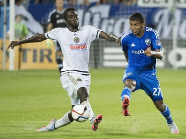 Montreal Impact's Johan Venegas, right, challenges Philadelphia Union's C.J. Sapong during first half MLS soccer action in Montreal, Saturday, August 22, 2015.