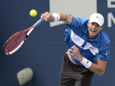 John Isner, of The United States, serves to Nick Kyrgios, of Australia, during round of sixteen play at the Rogers Cup tennis tournament on Thursday, August 13, 2015, in Montreal.