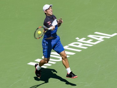 Kei Nishikori of Japan returns to Pablo Andujar of Spain during second round of play at the Rogers Cup tennis tournament Wednesday August 12, 2015 in Montreal.