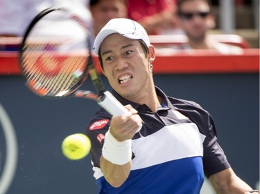Kei Nishikori of Japan returns to Pablo Andujar of Spain during second round of play at the Rogers Cup tennis tournament Wednesday August 12, 2015 in Montreal.