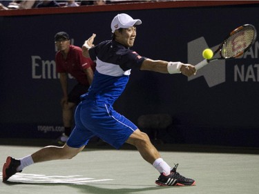 Kei Nishikori, of Japan, returns to David Goffin, of Belgium, during round of sixteen play at the Rogers Cup tennis tournament on Thursday, August 13, 2015, in Montreal.