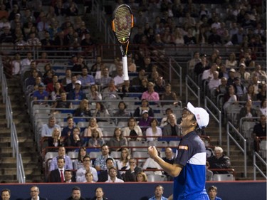 Kei Nishikori, of Japan, throws his racket in the air after missing a return to David Goffin, of Belgium, during round of sixteen play at the Rogers Cup tennis tournament on Thursday, August 13, 2015, in Montreal.