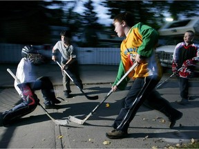 Kids play road hockey in Edmonton.