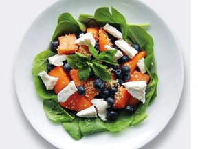 Melon and blueberries colour up a late summer salad accented with mint.