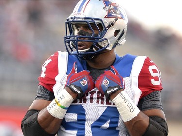 Montreal Alouettes' Michael Sam is set to make his pro football debut as he warms up before the first half of a CFL game against the Ottawa Redblacks in Ottawa on Friday, Aug. 7, 2015.