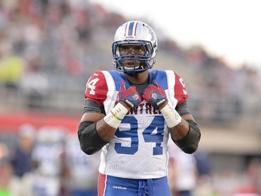 Montreal Alouettes' Michael Sam is set to make his pro football debut as he warms up before the first half of a CFL game against the Ottawa Redblacks in Ottawa on Friday, Aug. 7, 2015.