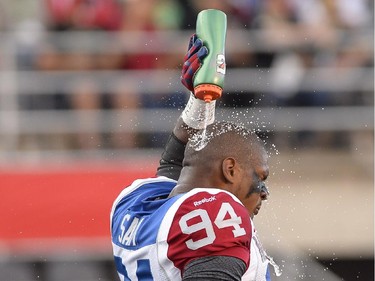 Montreal Alouettes' Michael Sam is set to make his pro football debut as he warms up before the first half of a CFL game against the Ottawa Redblacks in Ottawa on Friday, Aug. 7, 2015.