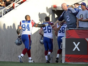 Montreal Alouettes' Michael Sam is set to make his pro football debut as greets fans before the first half of a CFL game against the Ottawa Redblacks in Ottawa on Friday, Aug. 7, 2015.