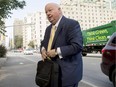 Former Conservative senator Mike Duffy arrives at the courthouse in Ottawa on Wednesday, Aug. 19, 2015. Duffy is facing 31 charges, including fraud, breach of trust and bribery.
