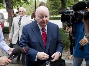 Former Conservative Senator Mike Duffy arrives at the courthouse for the second day of testimony by Chris Woodcock, former director of issues management in the Prime Minister's Office, in Ottawa.