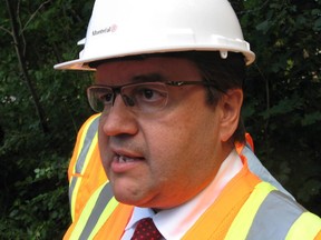 Montreal Mayor Denis Coderre addresses media following his use of a jackhammer to destroy a concrete foundation, which was laid for an unauthorized community mailbox at the entrance to Anse-a-l'Orme Nature Park, in Montreal, on Thursday, August 13, 2015.