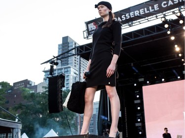 A model walks and poses on the catwalk wearing an outfit from Harricana par Mariouche collection, on Wednesday August 19, 2015, at the Festival Mode and Design, in Montreal.