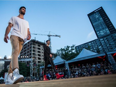 Two male models walk the catwalk wearing two outfits from the Hip and Bone collection, on Wednesday August 19, 2015, at the Festival Mode and Design, in Montreal.