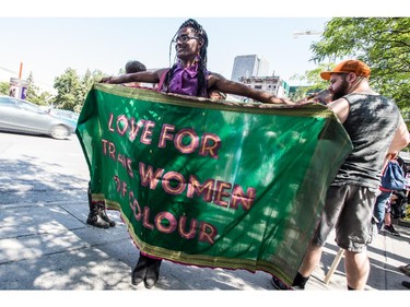 MONTREAL, QC.: AUGUST 9, 2015 -- Kama La Mackerel opens her "Love For Trans Women Of Colour" banner during the Montreal Trans March 2015, at Place-des-Arts, in Montreal, Quebec, on Sunday August 9, 2015. (Giovanni Capriotti / MONTREAL GAZETTE)