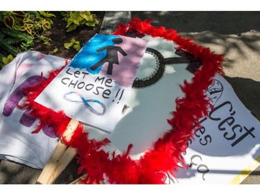 MONTREAL, QC.: AUGUST 9, 2015 -- Some of the signs for the Montreal Trans March 2015, lay on the ground at Place-des-Arts, before the beginning of the Montreal Trans March 2015, in Montreal, Quebec, on Sunday August 9, 2015. (Giovanni Capriotti / MONTREAL GAZETTE)