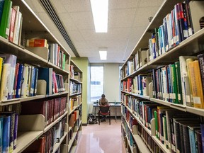 A woman studies at the library inside the McGill University Faculty of Medicine McIntyre Medical Building.