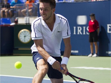 Canadian tennis player Filip Peliwo stretches returns shot against Sergiy Stakhovsky of the Ukraine at the Rogers Cup at Jarry Tennis stadium Monday, August 10, 2015. Stakhovsky won the match.