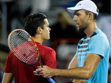 Ivo Karlovic (CRO), right, is congratulated by  Milos Raonic (CAN) during Rogers Cup action in Montreal on Tuesday August 11, 2015. Karlovic won the match in 2 sets.
