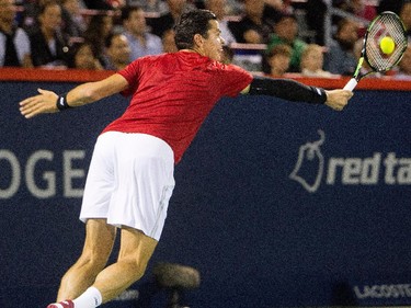 Milos Raonic (CAN) returns the ball to Ivo Karlovic (CRO) during Rogers Cup action in Montreal on Tuesday August 11, 2015.