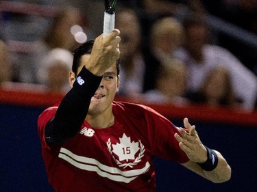 Milos Raonic (CAN) watches the ball after returning the ball to Ivo Karlovic (CRO) during Rogers Cup action in Montreal on Tuesday August 11, 2015.