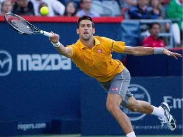 Novak Djokovic (SRB) returns the ball to Thomaz Bellucci (BRA) during Rogers Cup action in Montreal on Tuesday August 11, 2015.
