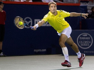 Tommy Robredo (ESP)  returns the ball to Murray (GBR) during Rogers Cup action in Montreal on Tuesday August 11, 2015.