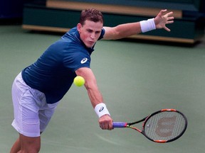 Vasek Pospisil returns the ball to Yen-Hsun Lu during Rogers Cup action in Montreal on Tuesday August 11, 2015. Pospisil won the match in two sets.
