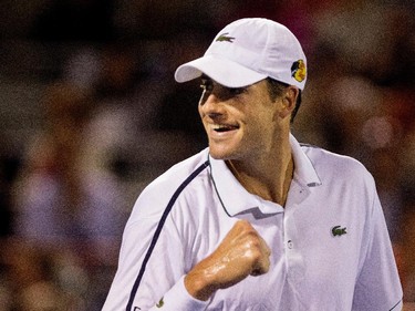 John Isner (USA) celebrates his win  over Vasek Pospisil (CAN)  during Rogers Cup action in Montreal on Wednesday August 12, 2015. Isner won the match 6 -7, 6-4, 3-6.