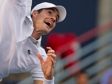 John Isner (USA) grimaces as he serves the ball to Vasek Pospisil (CAN)  during Rogers Cup action in Montreal on Wednesday August 12, 2015.