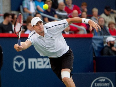 John Isner (USA) returns the ball to Vasek Pospisil (CAN)  during Rogers Cup action in Montreal on Wednesday August 12, 2015.