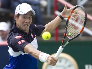 Kei Nishikori from Japan, returns backhand ball during his match against Pablo Andujar from Spain, during Rogers Cup action in Montreal on Wednesday August 12, 2015.