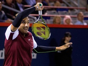 Nick Kyrgios returns ball to Stan Wawrinka  during Rogers Cup action in Montreal on Aug. 12, 2015.